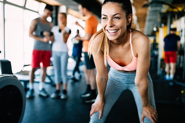 Woman smiling at the gym